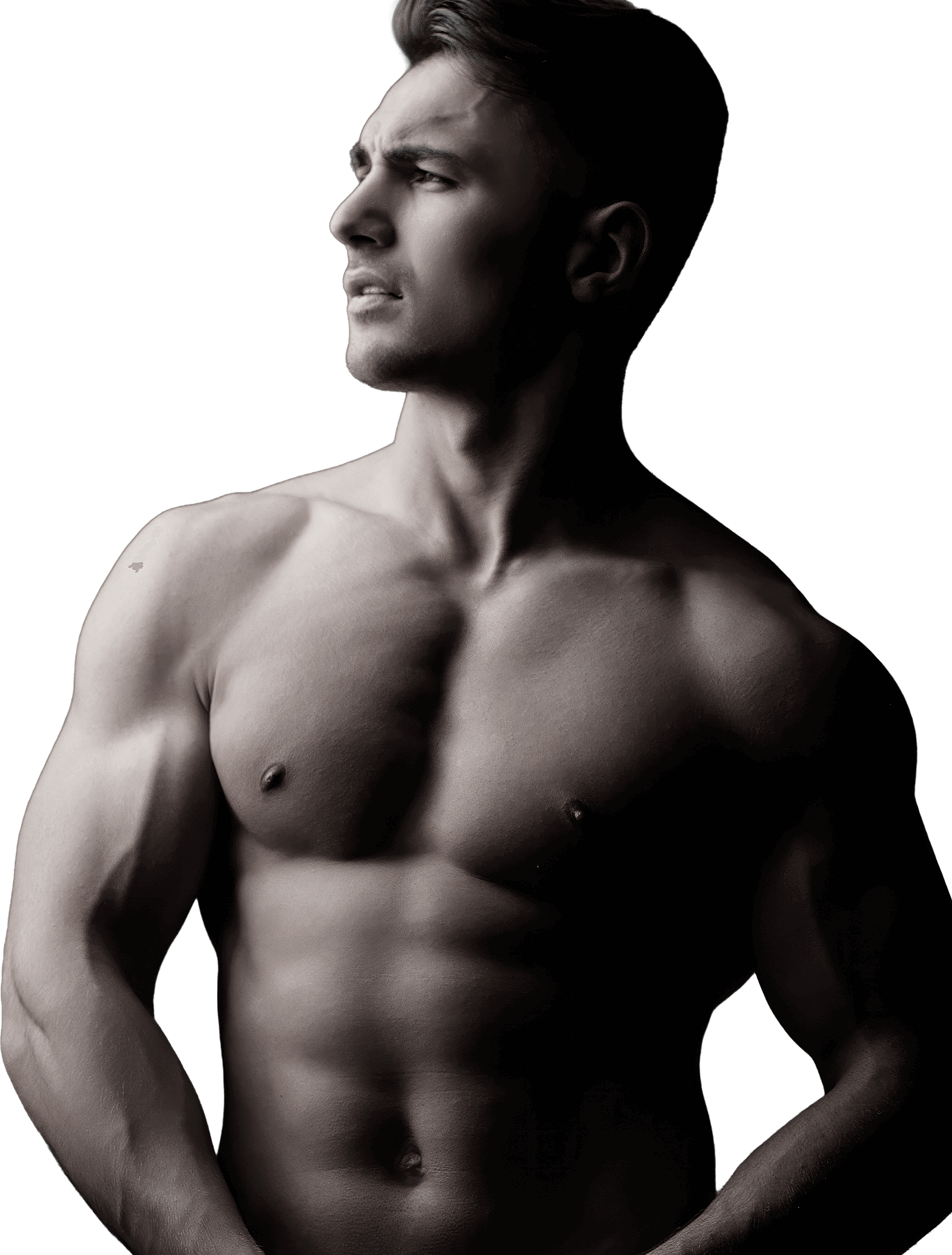 Muscular young man in profile against black background.