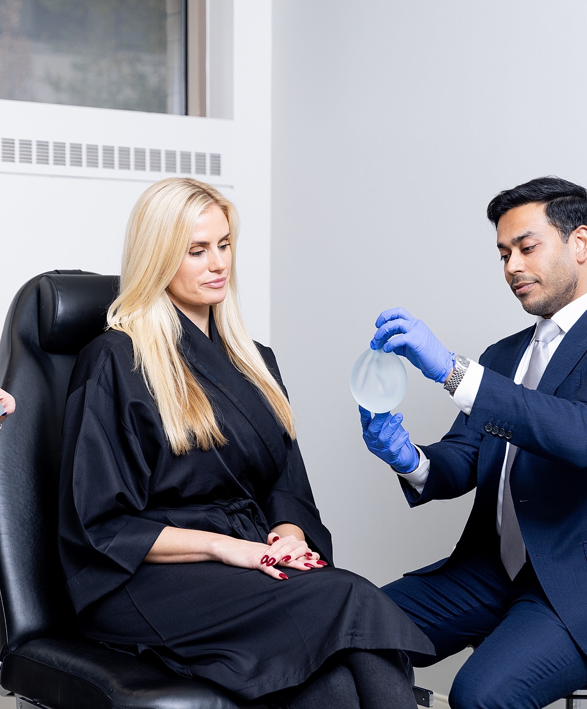 Consultation for breast augmentation procedure in progress.