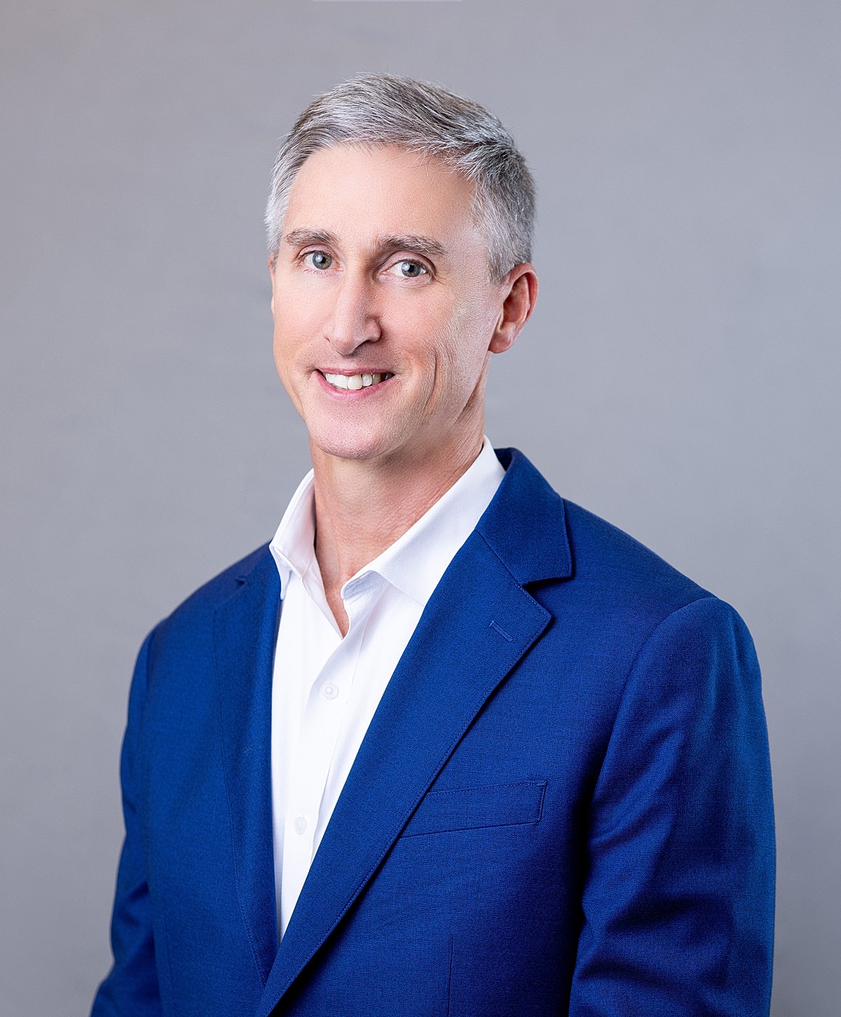 Smiling man in a blue suit jacket