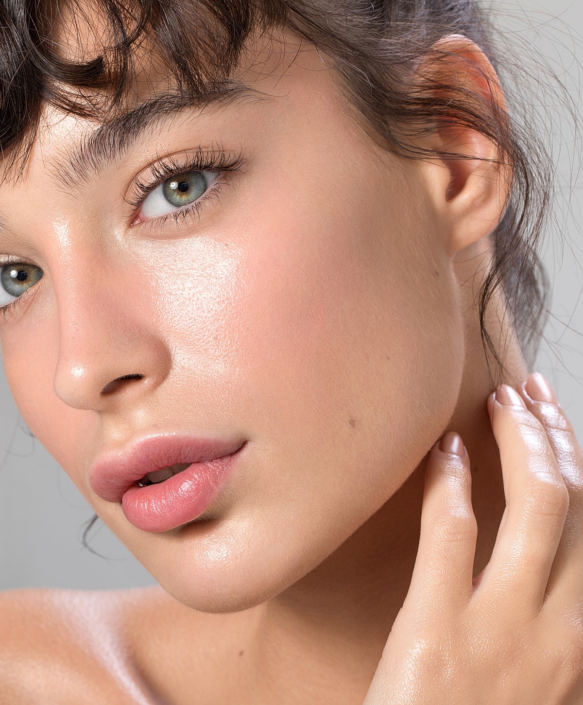 Close-up of a woman’s face with radiant skin.