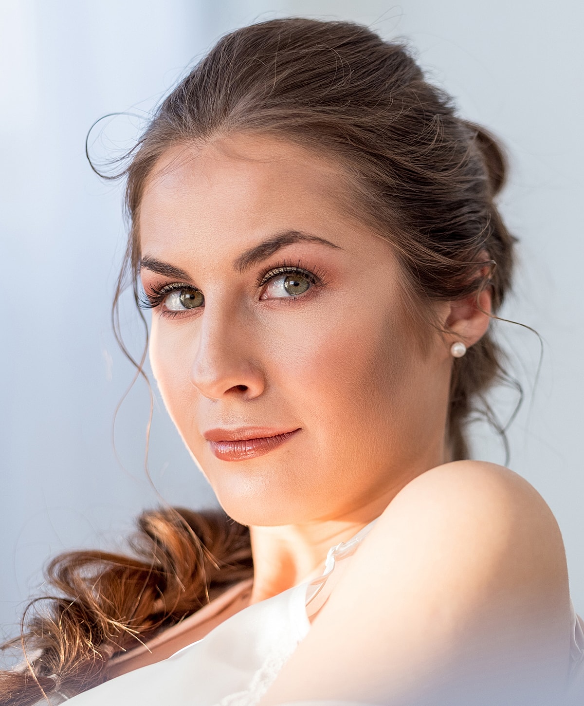 Close-up of a woman's face, soft lighting.