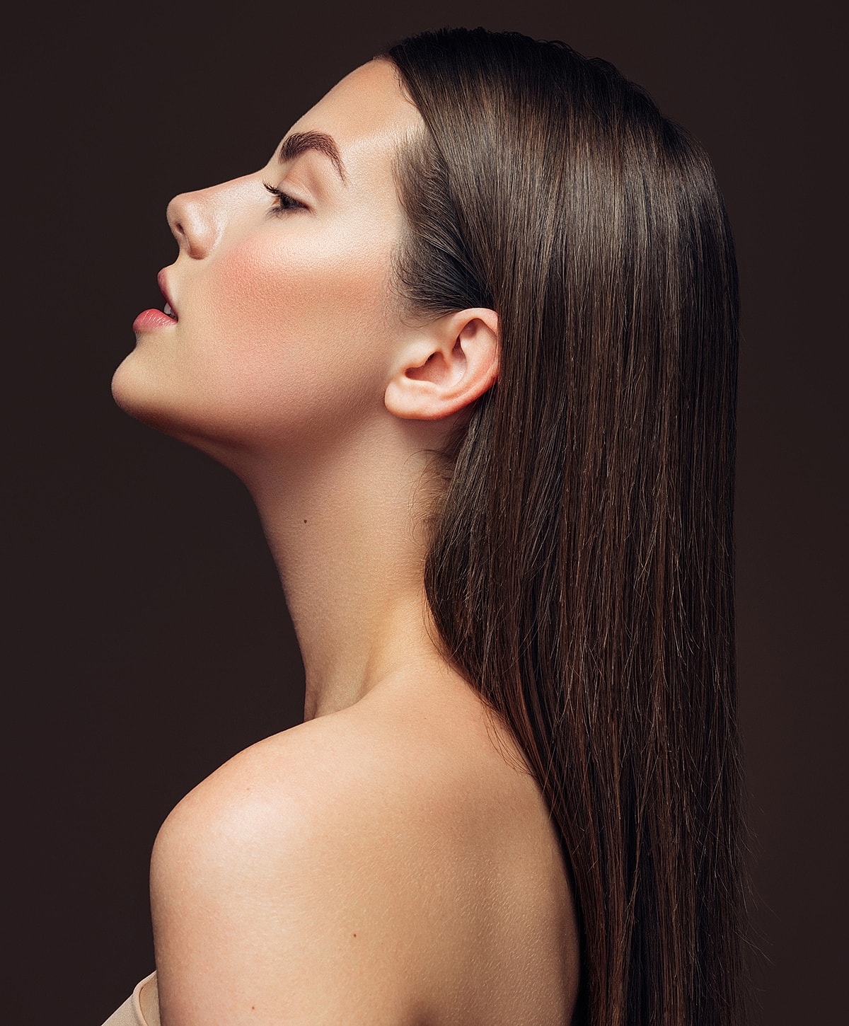 Profile view of a woman with long hair.