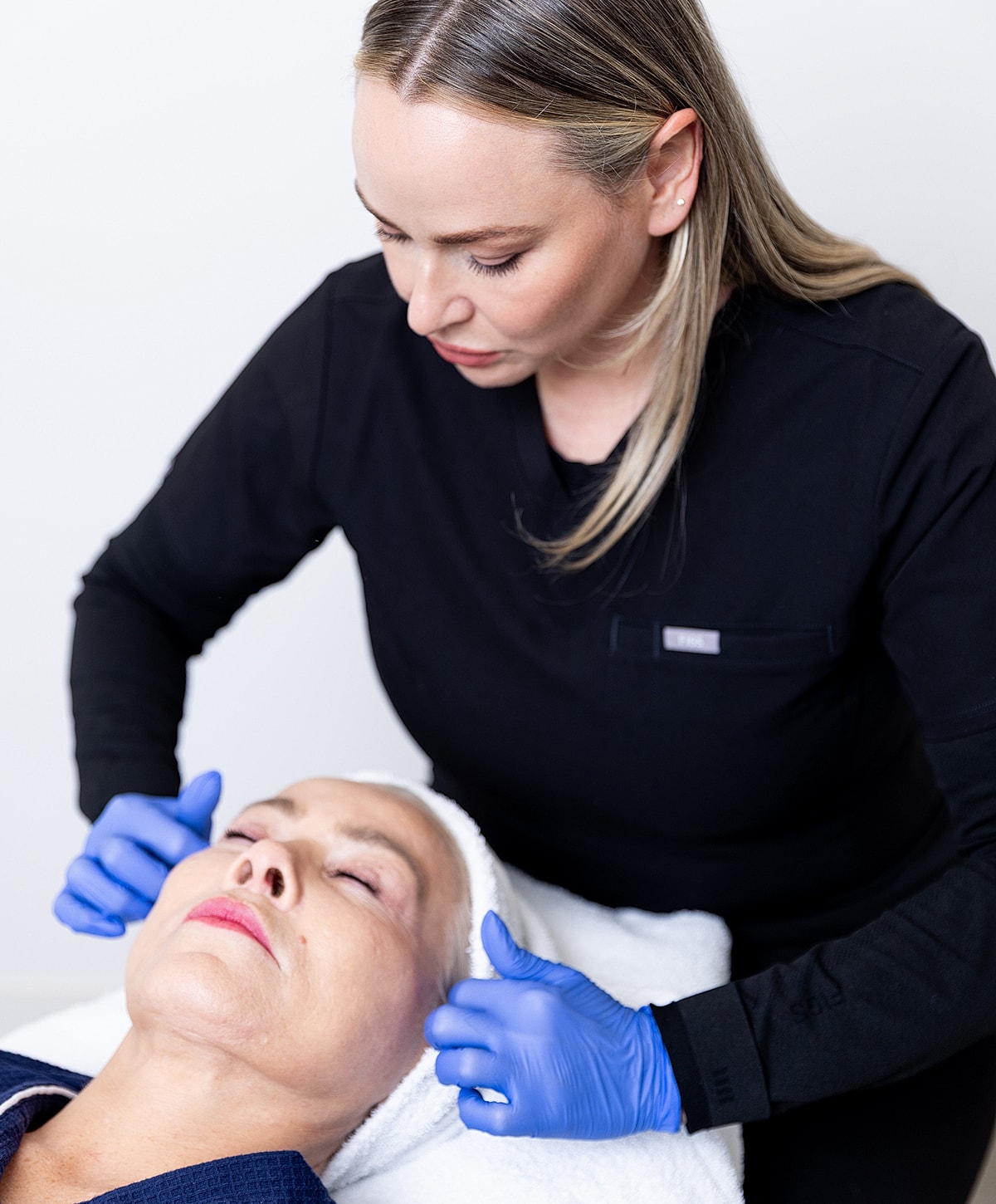 Facial treatment in progress at a spa.