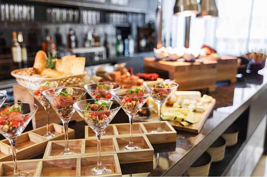 Elegant buffet with gourmet appetizers and drinks.