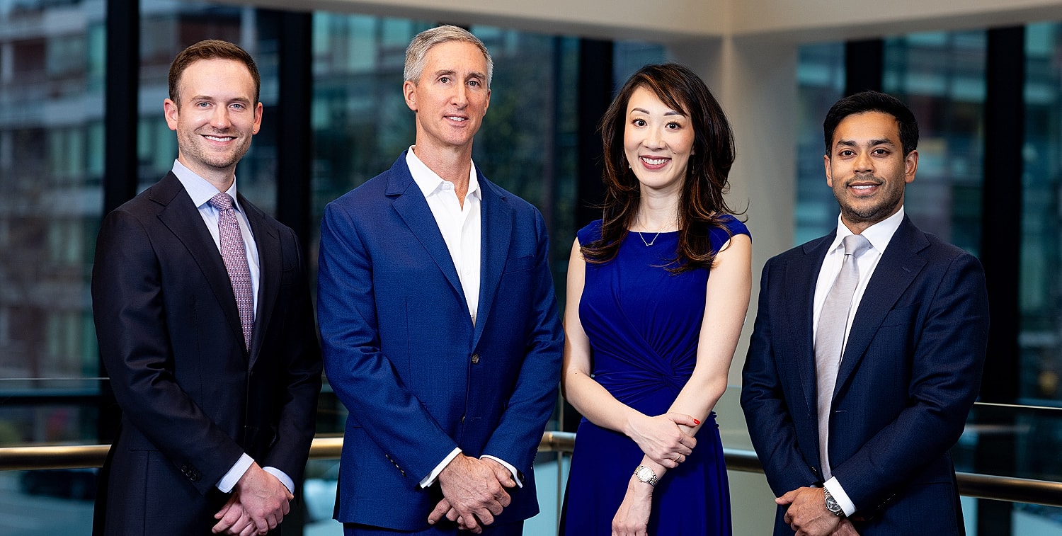 Professional group portrait in a modern office.