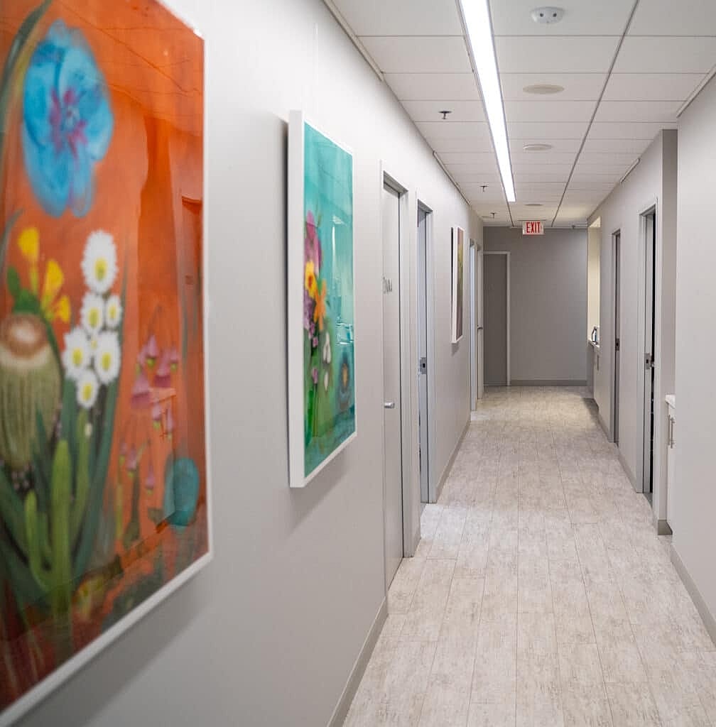 Colorful art in a modern hallway setting.