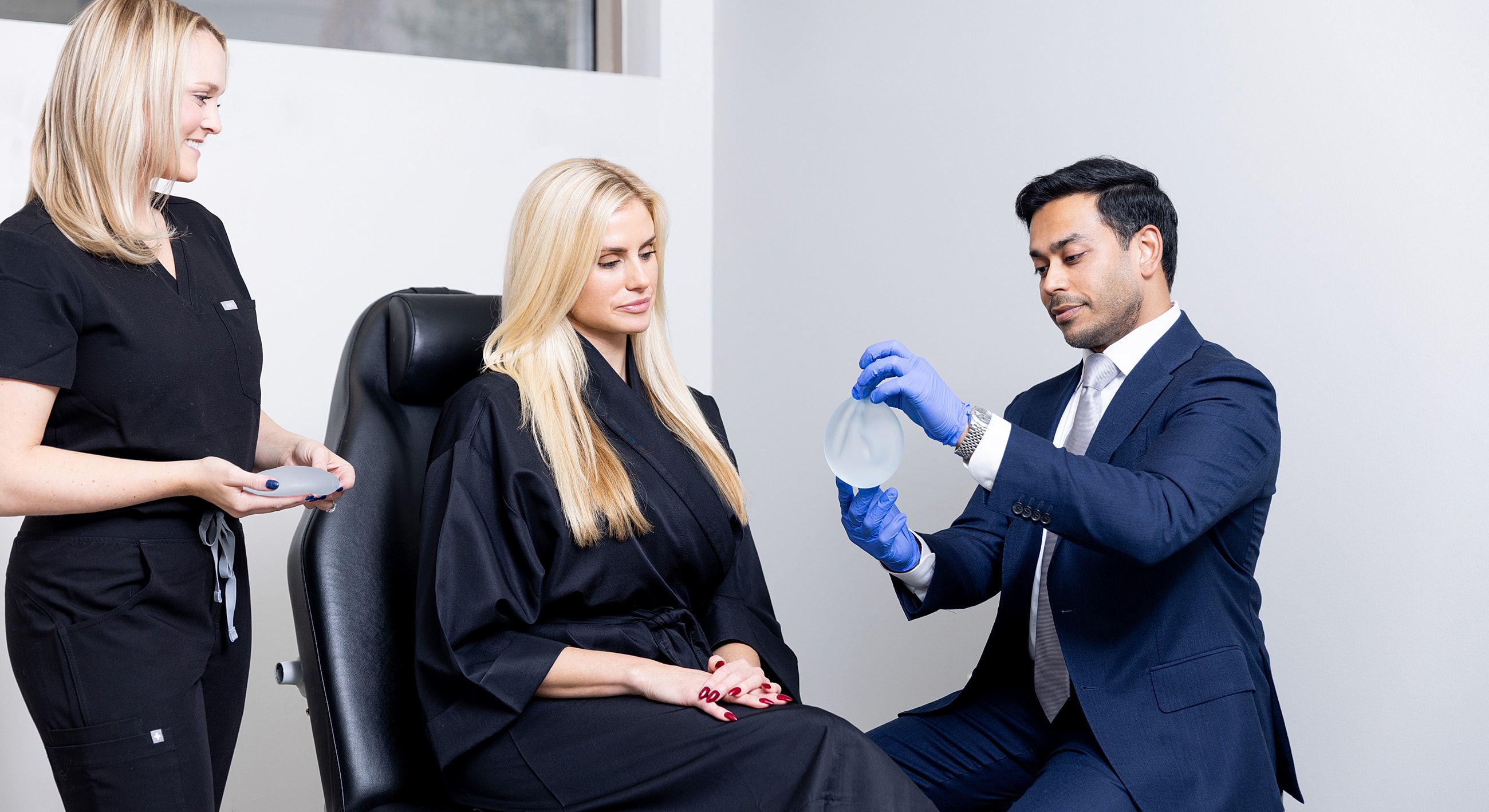 Consultation for breast augmentation procedure with patient.