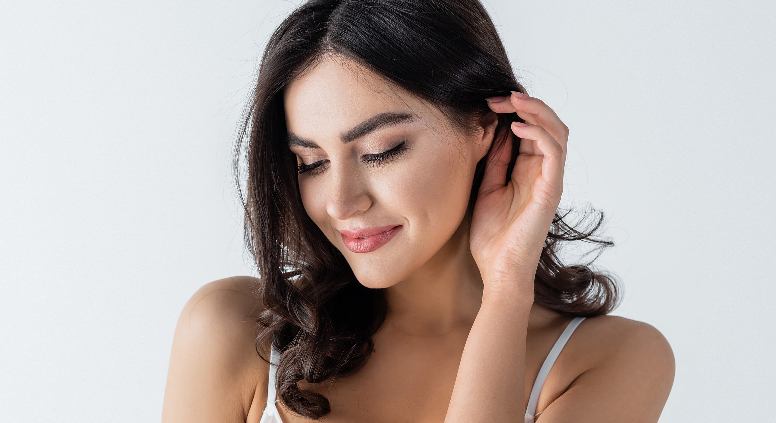 Woman smiling with soft, flowing hair.