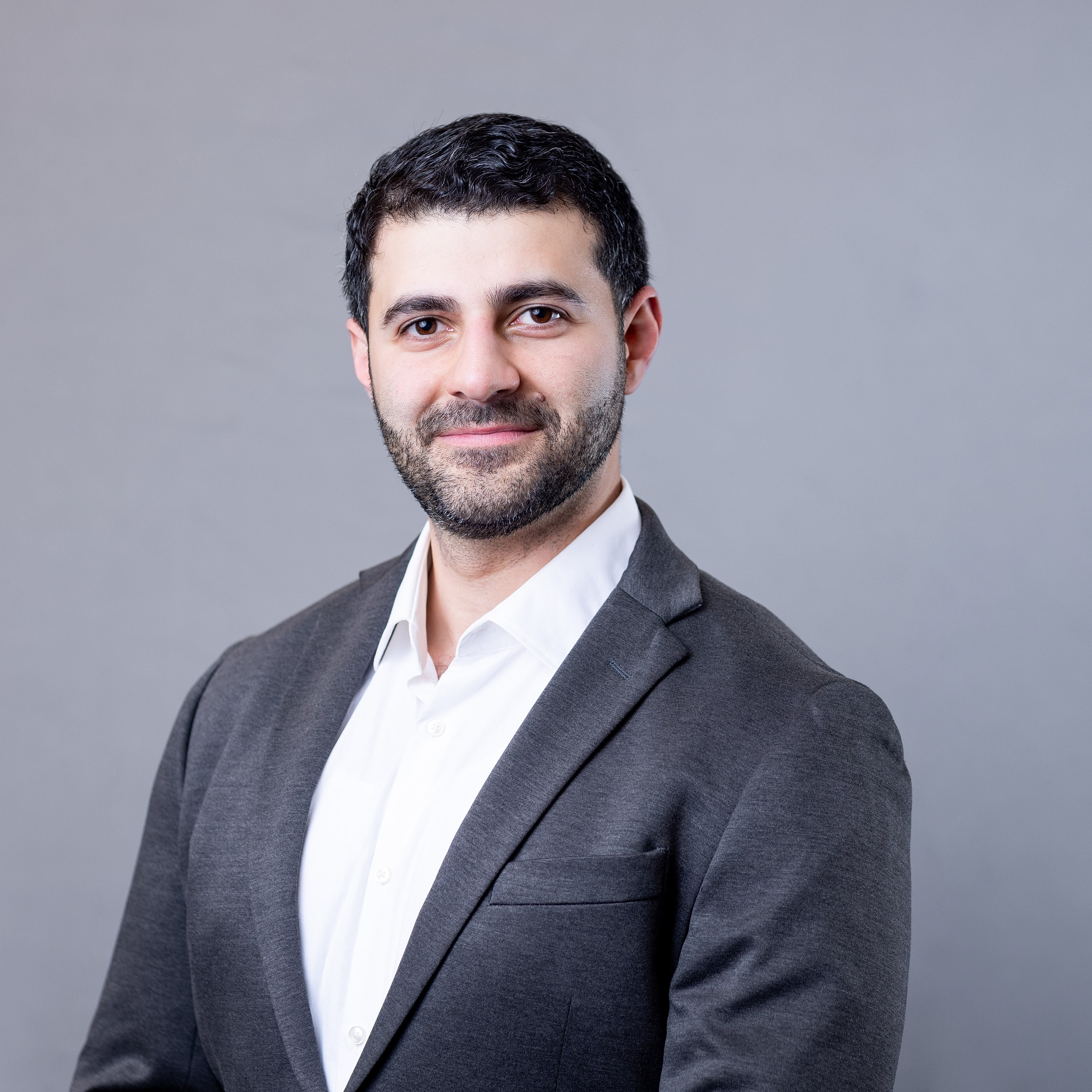 Professional portrait of a man in suit.