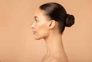 Side profile of woman with beautiful nose from rhinoplasty in Washington, DC